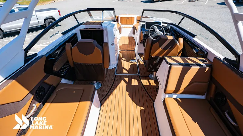 Slide: The Image of 2025 Yamaha Boats 252SD interior with tan seating and sleek design at Long Lake Marina. - 3
