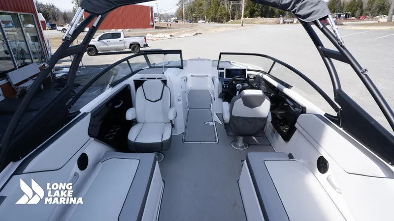 Slide: The Image of 2021 Yamaha Boats AR250 interior at Long Lake Marina, featuring sleek seating and modern controls. - 12