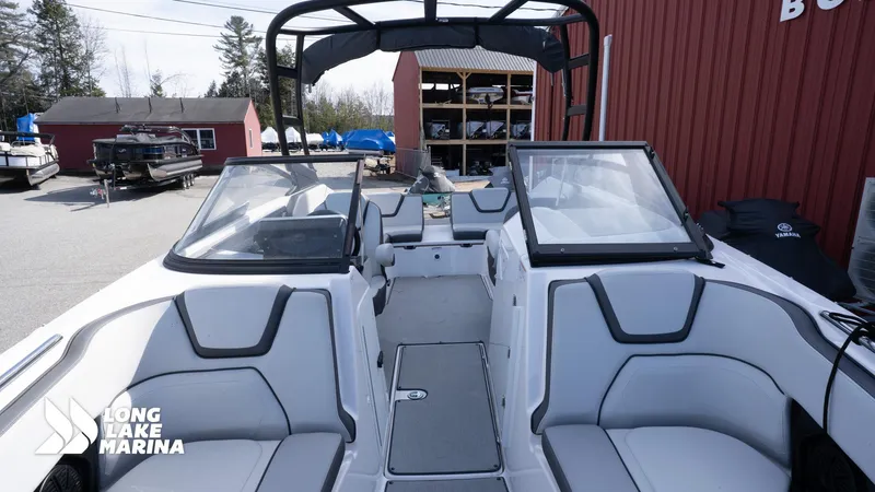Slide: The Image of 2021 Yamaha AR250 boat interior at Long Lake Marina, featuring sleek seating and windshield. - 7