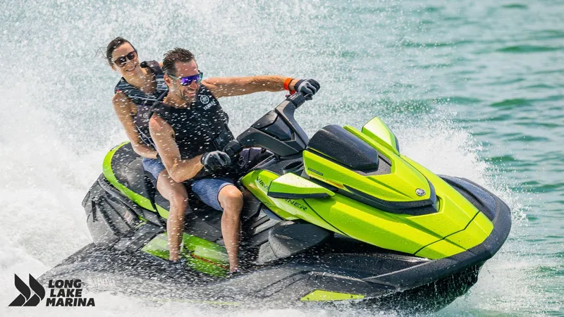 Slide: The Image of 2024 Yamaha FX Cruiser SVHO w/ Audio jet ski on water, two riders enjoying the ride. - 4