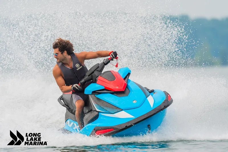Slide: The Image of 2024 Yamaha VX Deluxe jet ski speeding on water at Long Lake Marina. - 3
