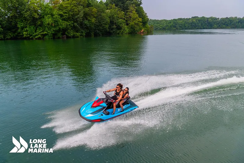 Slide: The Image of 2024 Yamaha VX Deluxe jet ski on a serene lake, Long Lake Marina logo visible. - 4