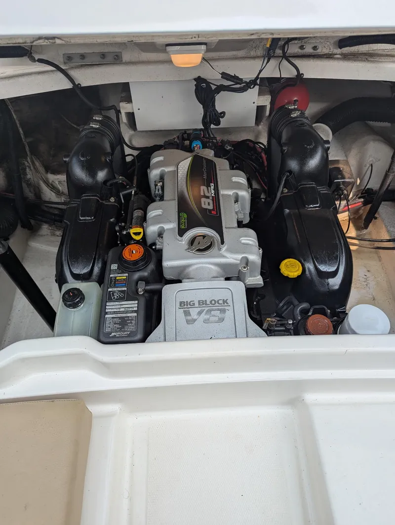 Slide: The Image of Engine compartment of a 2015 Sea Ray 270 SLX boat, featuring a powerful motor. - 10