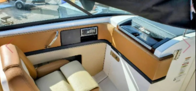 Slide: The Image of Interior of 2015 Sea Ray 270 SLX boat with tan and white seating. - 4