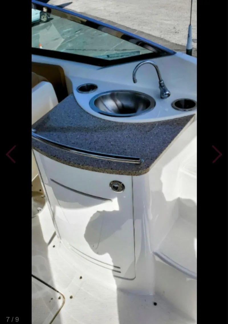 Slide: The Image of 2015 Sea Ray 270 SLX boat sink with countertop and faucet. - 7