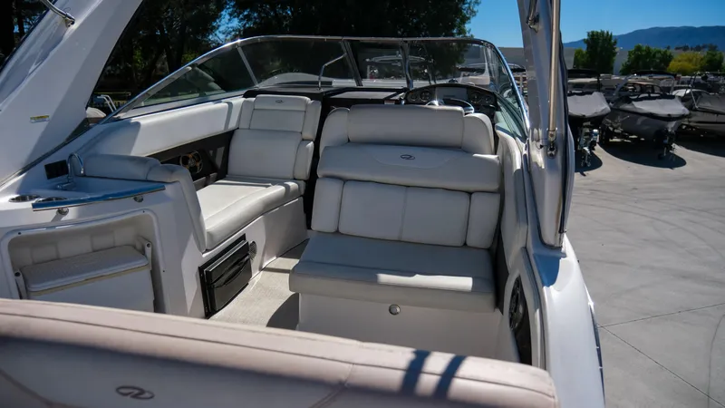 Slide: The Image of 2013 Regal 28 Express boat interior with white seating and dashboard. - 10
