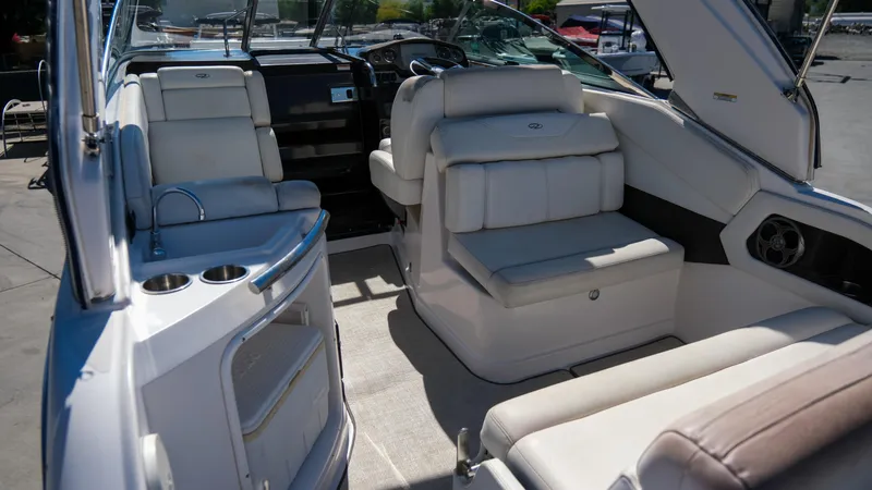 Slide: The Image of Interior of 2013 Regal 28 Express boat with white seating and modern design. - 11