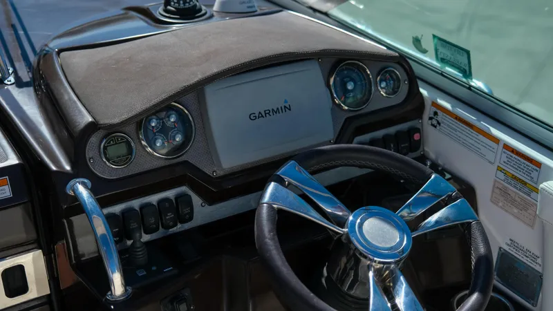 Slide: The Image of Dashboard of a 2013 Regal 28 Express boat with Garmin navigation system. - 15