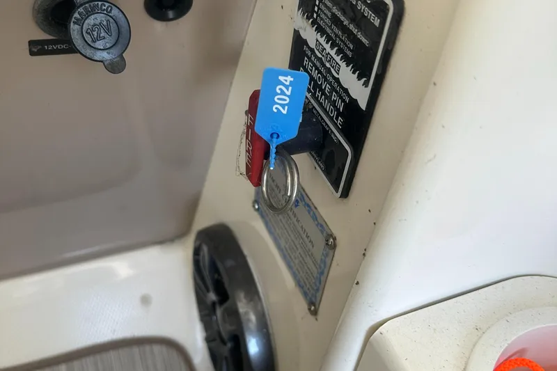 Slide: The Image of Control panel of a 2006 Sea Ray 360 Sundancer with a 2024 key tag. - 10