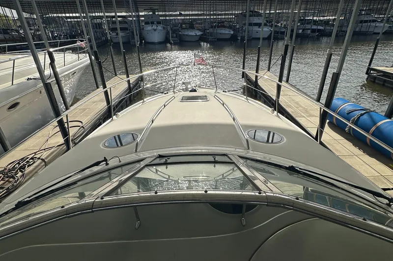 Slide: The Image of 2006 Sea Ray 360 Sundancer docked at marina, view from bow. - 11