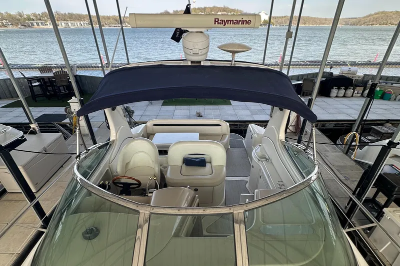 Slide: The Image of 2006 Sea Ray 360 Sundancer yacht docked, featuring spacious cockpit and Raymarine radar. - 12