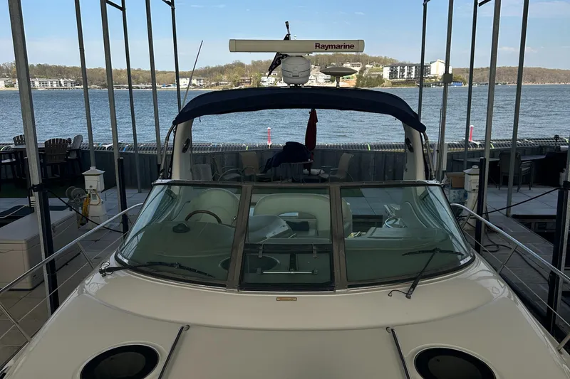 Slide: The Image of 2006 Sea Ray 360 Sundancer docked with scenic waterfront view. - 13