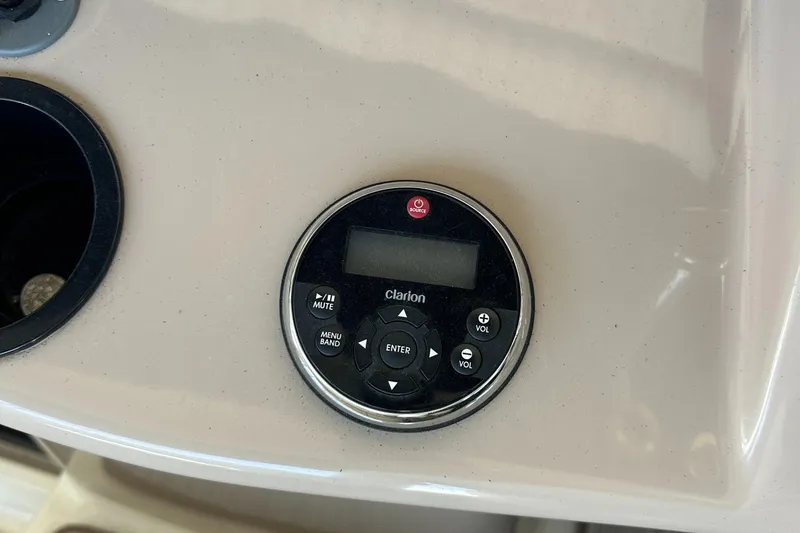Slide: The Image of Clarion audio control panel on 2006 Sea Ray 360 Sundancer boat dashboard. - 17