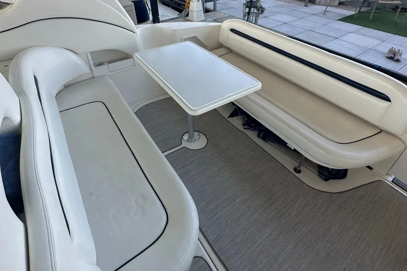 Slide: The Image of 2006 Sea Ray 360 Sundancer interior with white seating and table. - 20