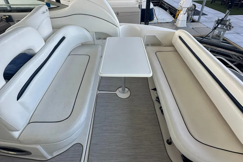 Slide: The Image of 2006 Sea Ray 360 Sundancer interior with white seating and table. - 21