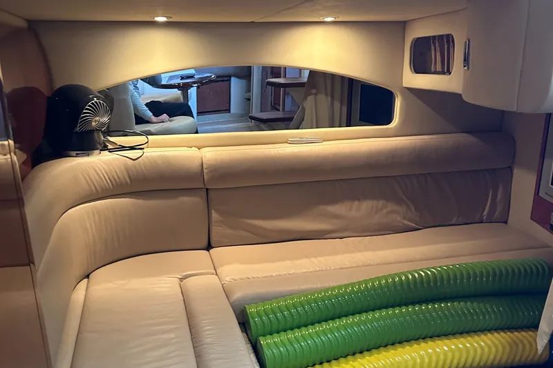 Slide: The Image of Interior of 2006 Sea Ray 360 Sundancer with beige seating and colorful tubing. - 33