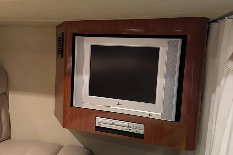 Slide: The Image of Built-in TV and DVD player in 2006 Sea Ray 360 Sundancer yacht interior. - 37