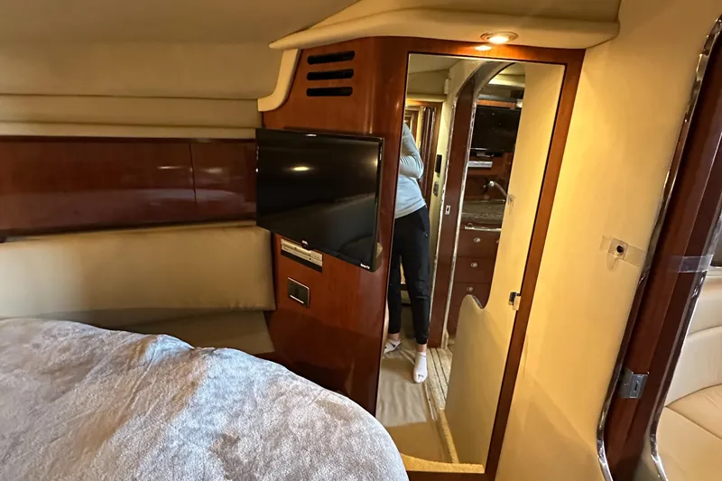 Slide: The Image of Interior of 2006 Sea Ray 360 Sundancer with TV and cozy cabin space. - 44