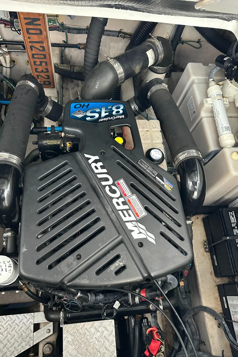 Slide: The Image of Engine compartment of a 2006 Sea Ray 360 Sundancer with Mercury components. - 47