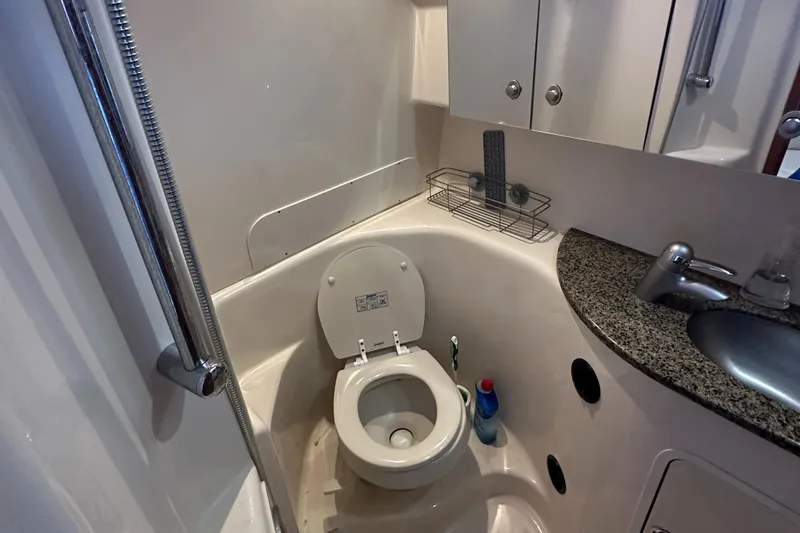 Slide: The Image of Bathroom interior of 2006 Sea Ray 360 Sundancer yacht with toilet and sink. - 48