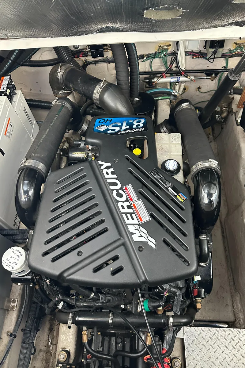 Slide: The Image of 2006 Sea Ray 360 Sundancer engine, featuring a Mercury motor in a compact, organized layout. - 49