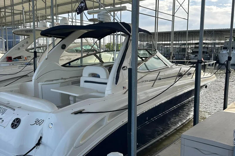 Slide: The Image of 2006 Sea Ray 360 Sundancer docked in a marina under a covered structure. - 5