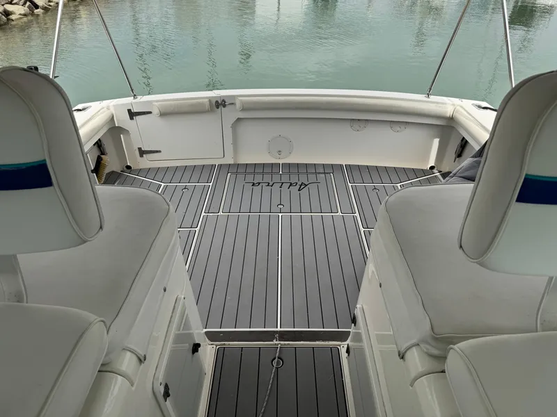 Slide: The Image of 1995 Wellcraft 330 Coastal boat interior with sleek seating and modern flooring. - 11