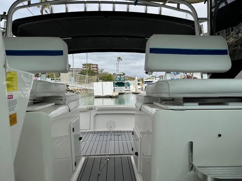 Slide: The Image of 1995 Wellcraft 330 Coastal boat interior with seating and marina view. - 15