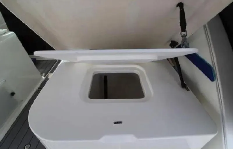 Slide: The Image of Open storage compartment on a 1995 Wellcraft 330 Coastal boat. - 22