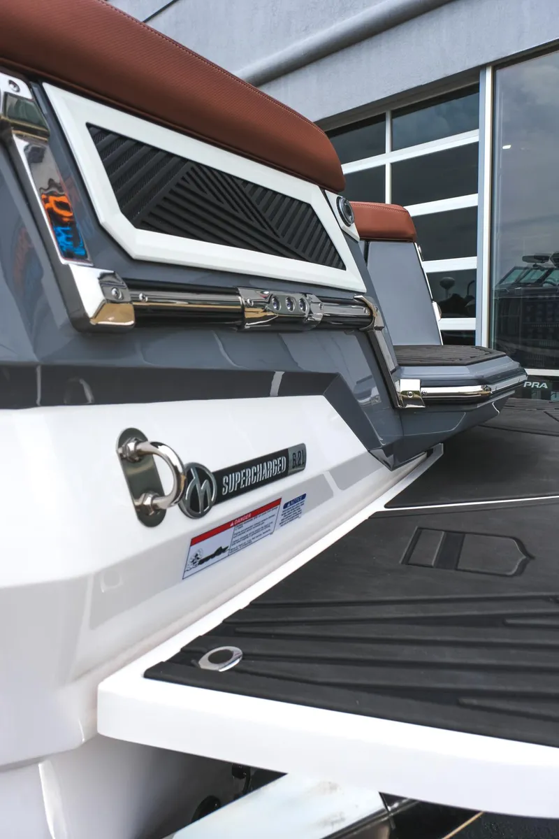 Slide: The Image of 2025 MasterCraft XStar 25 boat rear view with sleek design and modern features. - 15