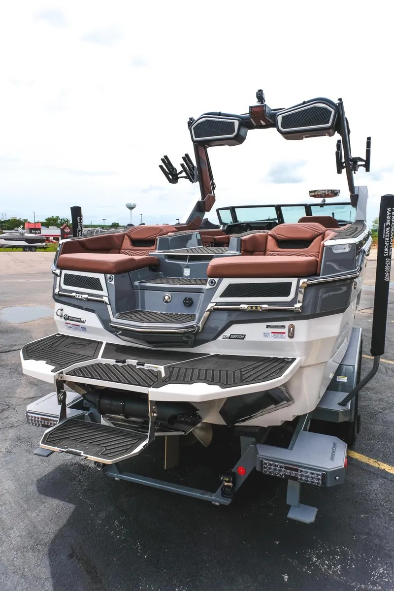 Slide: The Image of 2025 MasterCraft XStar 25 boat with sleek design and luxurious seating. - 16