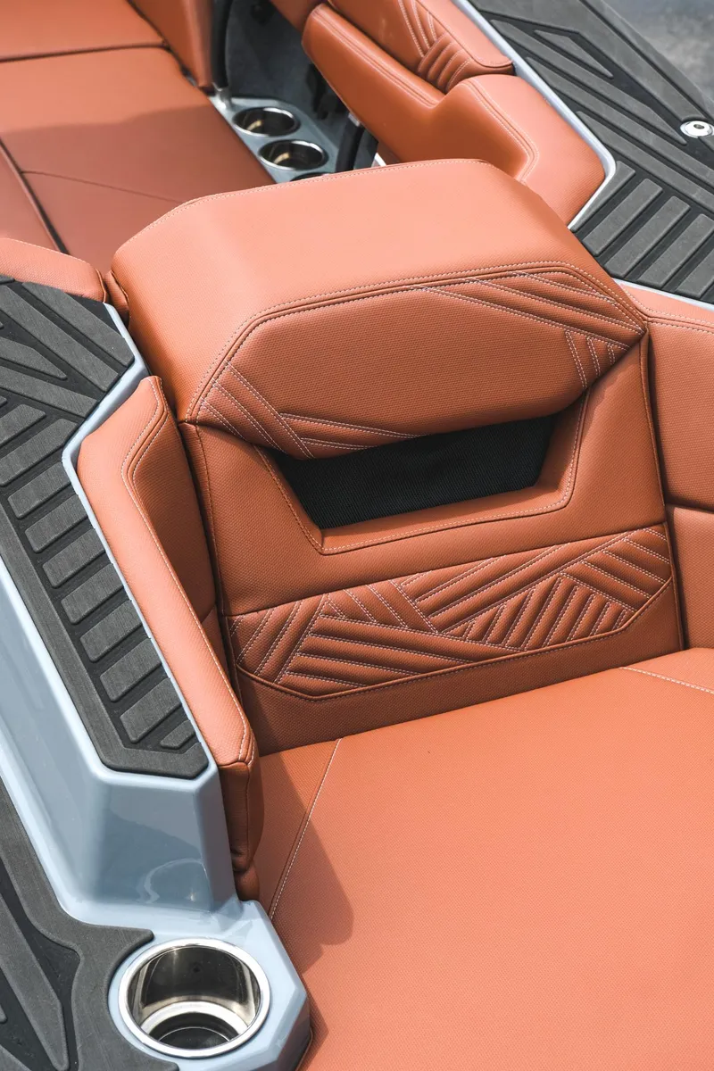 Slide: The Image of 2025 MasterCraft XStar 25 interior with luxurious brown leather seating and modern design. - 18