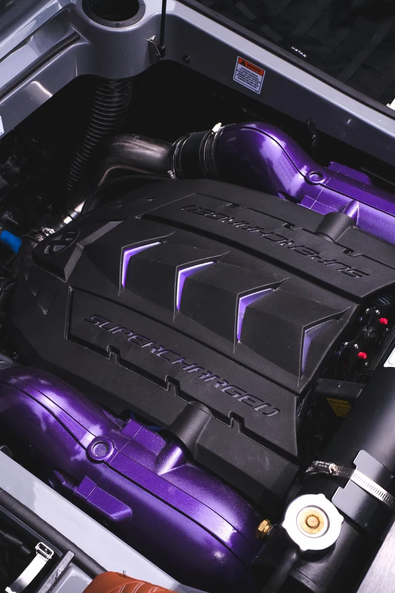 Slide: The Image of 2025 MasterCraft XStar 25 engine with purple accents and sleek design. - 24
