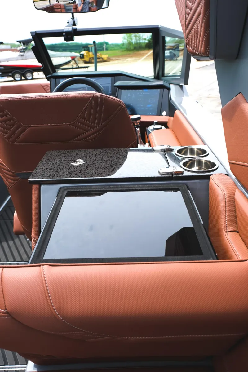 Slide: The Image of 2025 MasterCraft XStar 25 interior with luxurious seating and modern dashboard features. - 35