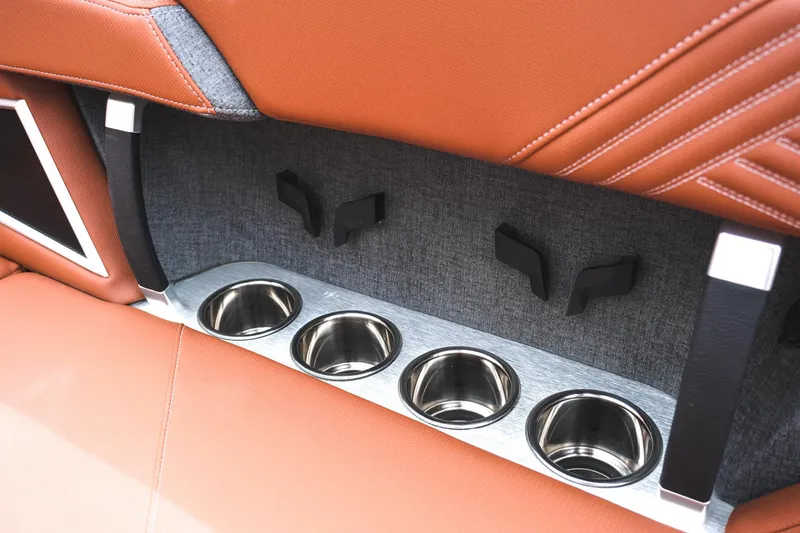 Slide: The Image of 2025 MasterCraft XStar 25 interior with leather seats and stainless steel cup holders. - 42