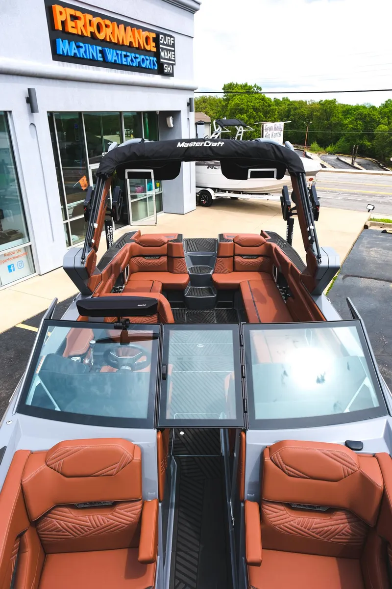 Slide: The Image of 2025 MasterCraft XStar 25 boat with luxurious seating at Performance Marine Watersport dealership. - 46