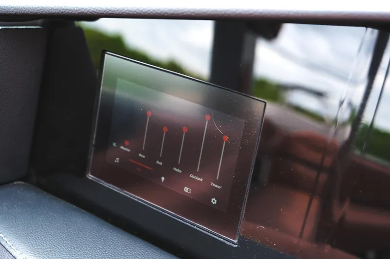 Slide: The Image of Touchscreen control panel in 2025 MasterCraft XStar 25 boat, displaying audio settings. - 49