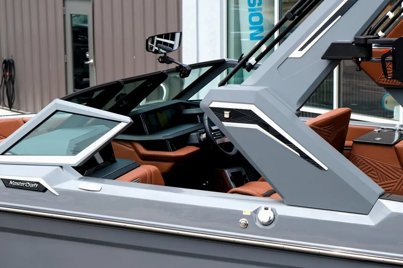 Slide: The Image of 2025 MasterCraft XStar 25 boat interior with modern design and luxurious seating. - 8