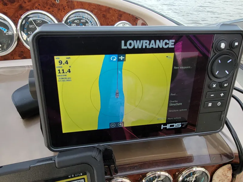 Slide: The Image of Lowrance HDS7 marine GPS on 2000 Regal 2860 Commodore dashboard, displaying navigation data. - 14