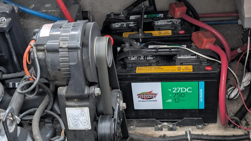 Slide: The Image of Engine compartment of a 2000 Regal 2860 Commodore with batteries and alternator. - 31