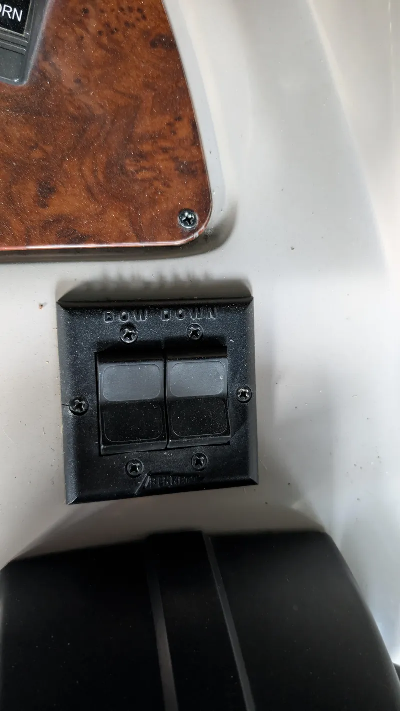 Slide: The Image of Control panel on a 2000 Regal 2860 Commodore boat with wood trim detail. - 40