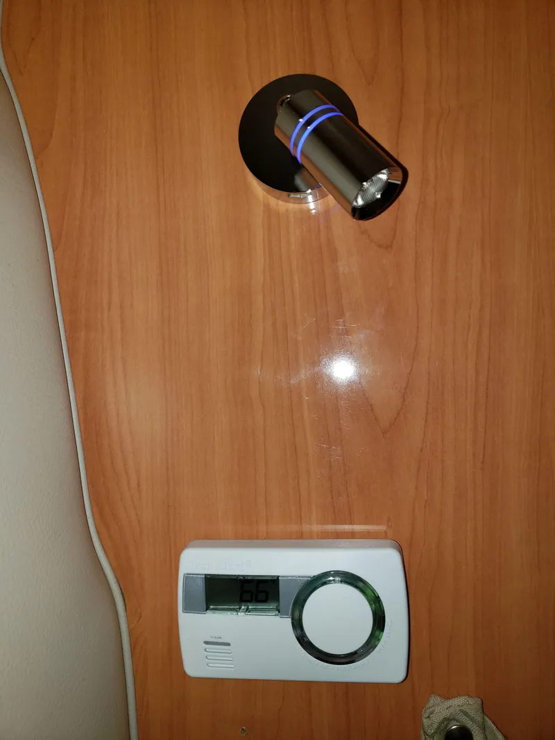 Slide: The Image of Wall-mounted light and thermostat in 2000 Regal 2860 Commodore boat interior. - 44