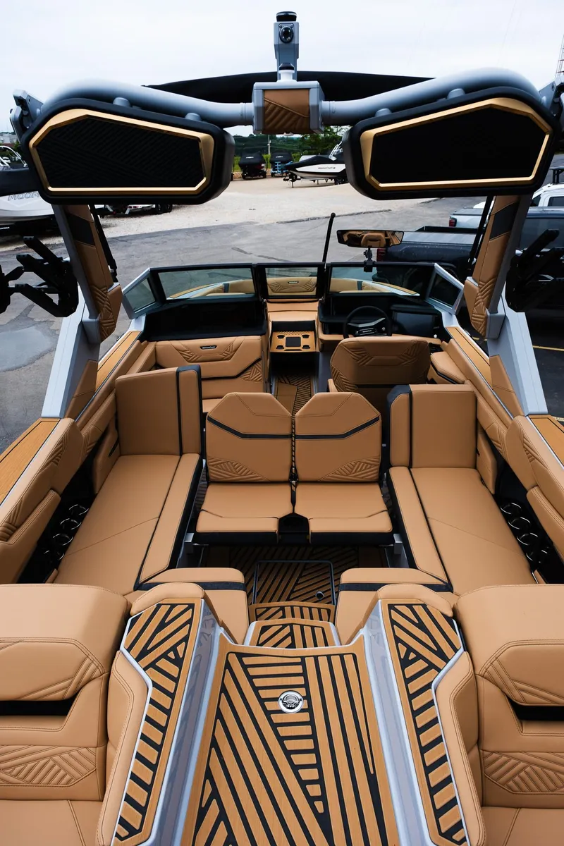 Slide: The Image of 2025 MasterCraft XStar 23 interior with luxurious tan seating and modern design elements. - 12