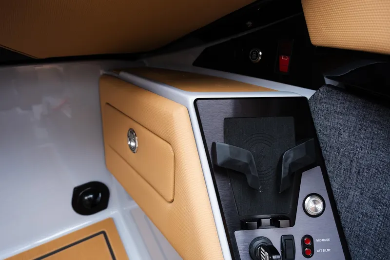 Slide: The Image of 2025 MasterCraft XStar 23 interior detail with tan upholstery and control panel. - 26