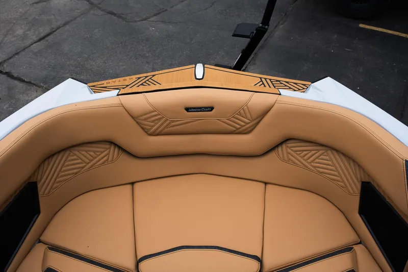 Slide: The Image of 2025 MasterCraft XStar 23 boat interior with tan leather seating and stylish stitching. - 29
