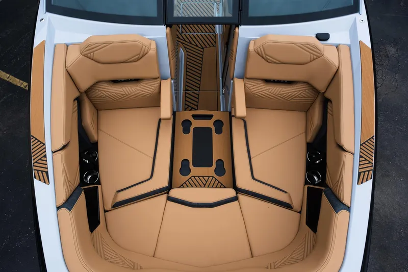 Slide: The Image of 2025 MasterCraft XStar 23 boat interior with tan leather seating and modern design. - 30