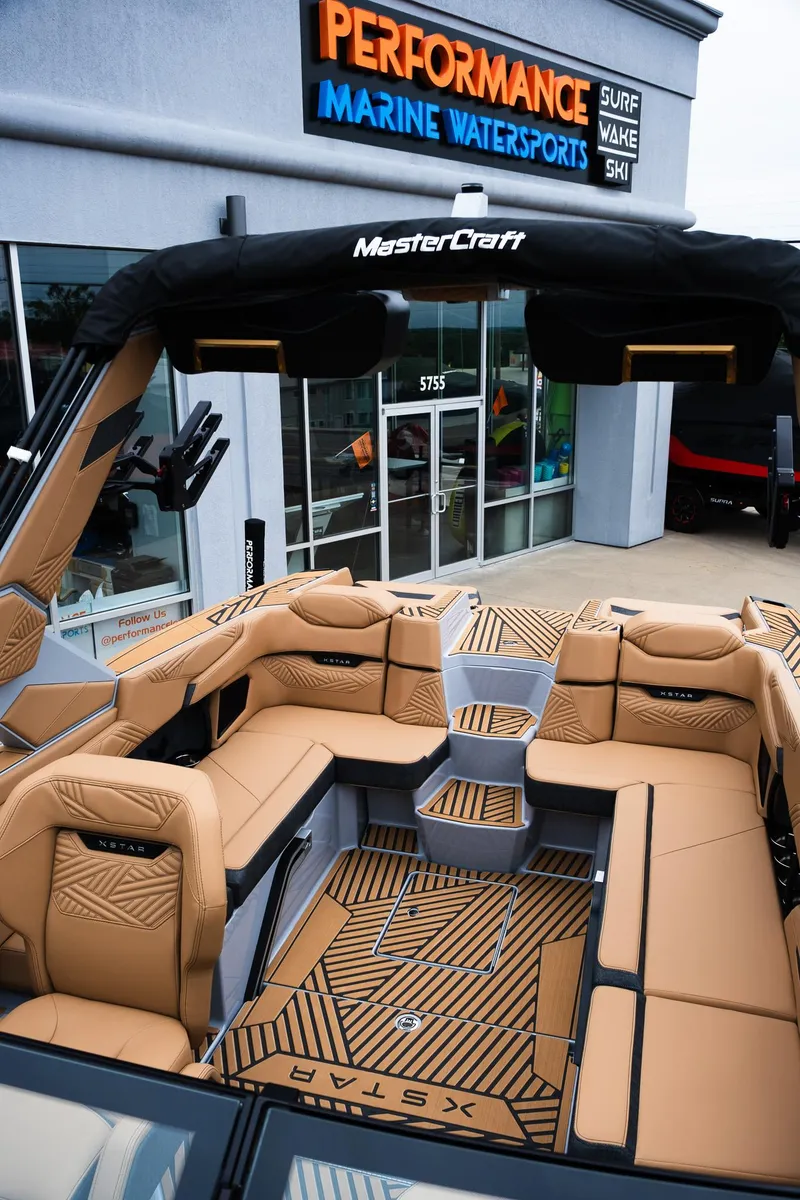 Slide: The Image of 2025 MasterCraft XStar 23 boat with luxurious seating at Performance Marine Watersports. - 31