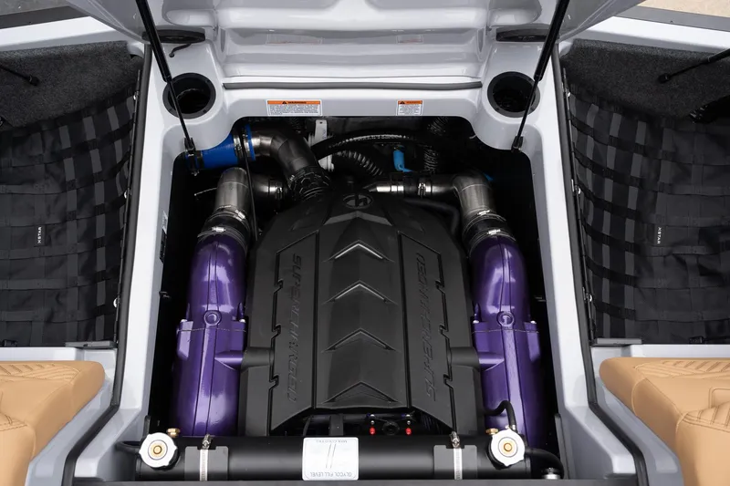 Slide: The Image of 2025 MasterCraft XStar 23 engine compartment with purple accents and sleek design. - 37