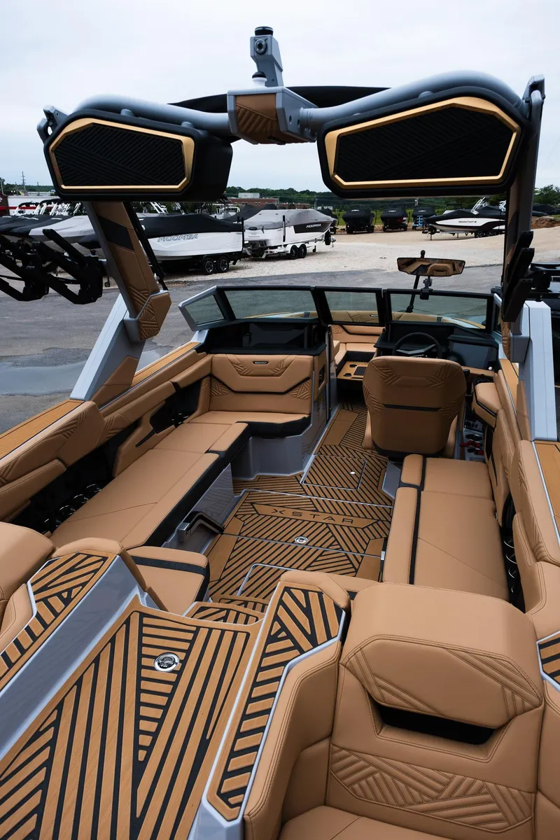 Slide: The Image of 2025 MasterCraft XStar 23 interior with luxurious tan seating and modern design elements. - 40