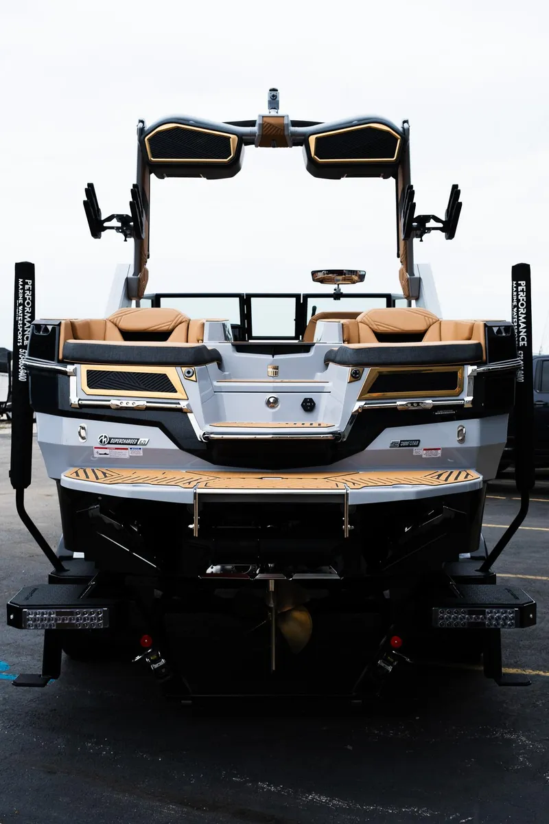 Slide: The Image of 2025 MasterCraft XStar 23 boat, rear view, showcasing sleek design and luxurious seating. - 6
